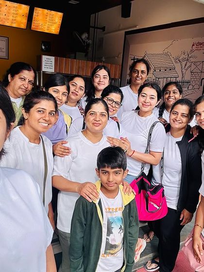 A happy group selfie after our Yoga Day practice. We celebrated with asanas, pranayama, and of course, some well-deserved treats together.