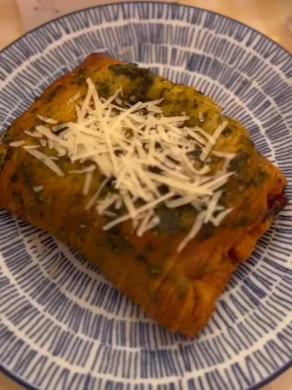 A Pork Pizza Puff from our Lollapalooza menu. This savoury pastry is filled with all the delicious flavours of a pizza, making it the perfect festival food.