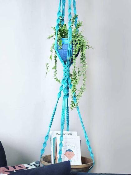 Level up your plant game with this epic 9-foot, triple-tier plant hanger. It's perfect for creating a lush vertical garden with your favorite trailing beauties.