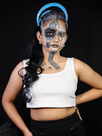 A full shot of the cyberpunk look, showing the contrast between the makeup and the simple outfit.