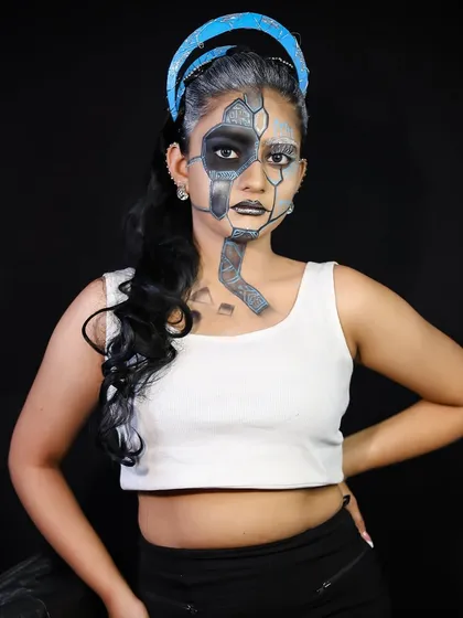 A full shot of the cyborg look, pairing the futuristic makeup with a modern, edgy outfit. This shows how to style a complete look for a portfolio.