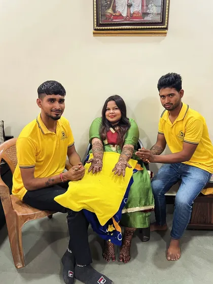 My artists with a client after her mehndi session at home. We also do foot mehndi to complete the traditional bridal look.