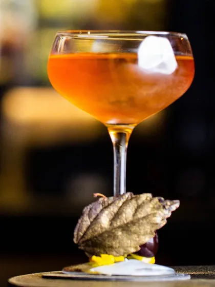 This is 'Kappi Nirwana', a smooth, spirit-forward cocktail with a smoky finish. We use smoked bourbon, enchanted coffee liqueur, robusta aperitif, and clarified coconut milk.