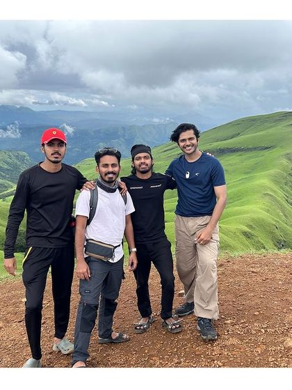 A group of friends at the top of Netravati, with the stunning backdrop of the Western Ghats.