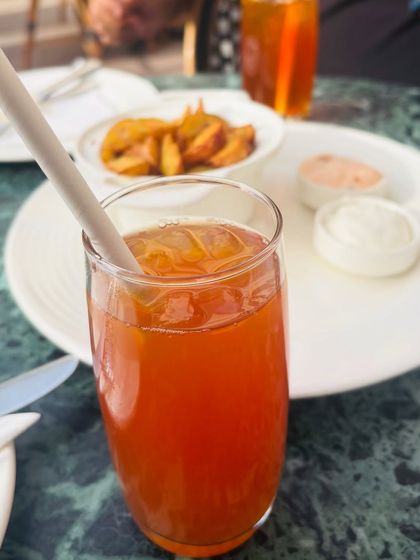 A close-up of a refreshing iced tea at a cafe, capturing a simple, pleasant moment.