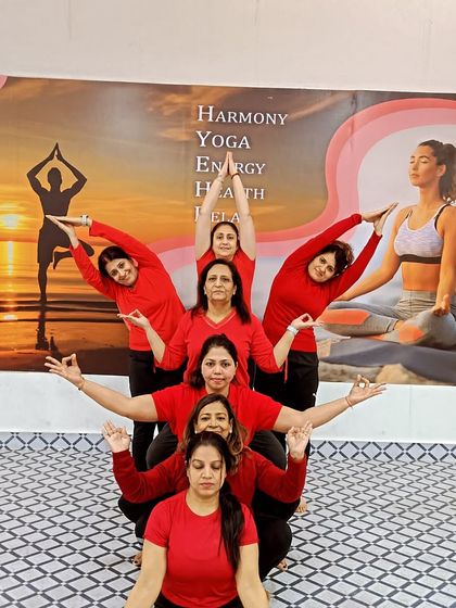 Our students creating a beautiful human pyramid during a group Acro Yoga session. This showcases the spirit of collaboration and shared achievement in our classes.