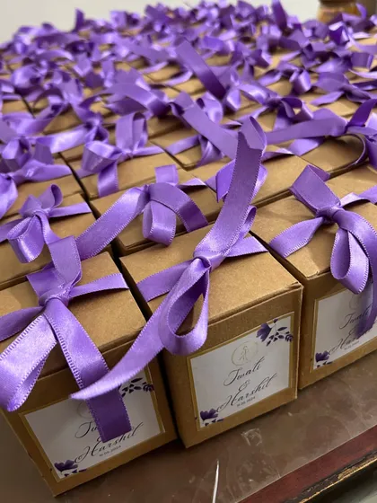 A sea of purple! We love how these custom-packaged wedding favors turned out. Each box contains a beautiful scented candle to thank the guests.