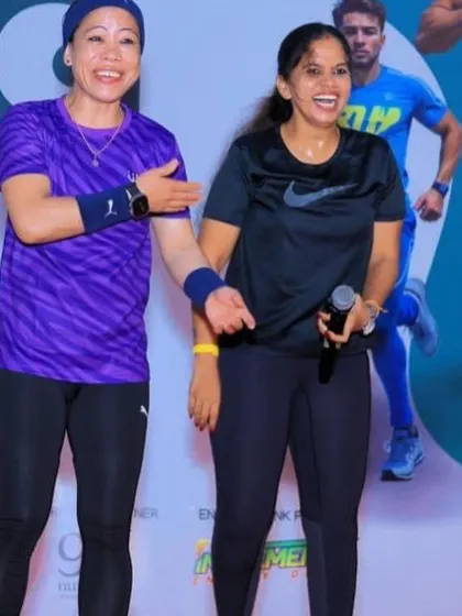 A candid, happy moment on stage with Mary Kom. I foster a positive and interactive atmosphere, making even the biggest celebrities feel like part of our running community.