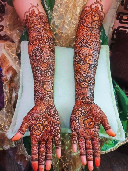 Two examples of my intricate bridal work, both featuring full-arm coverage and a beautiful final stain.