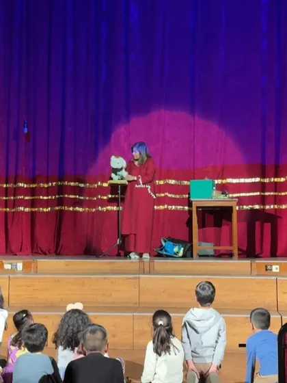Snowey the dog puppet takes center stage. Each puppet has its own unique voice and personality.