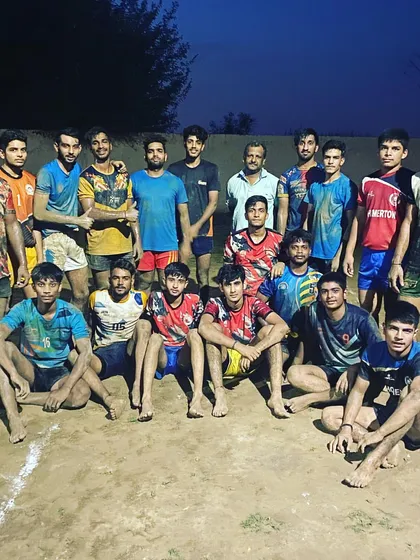 Covered in mud but full of spirit. The team after a tough practice on a rainy day.