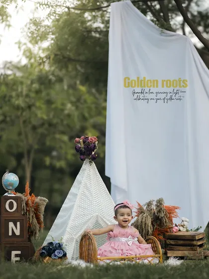 A whimsical outdoor first birthday shoot with a rustic boho theme. Using natural light and elements like a teepee and wooden props, I create a warm and earthy setting for your little one's celebration.