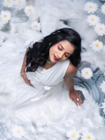 Lost in a world where time slows down and flowers whisper their secrets. This frame feels like a dream woven in white and water.