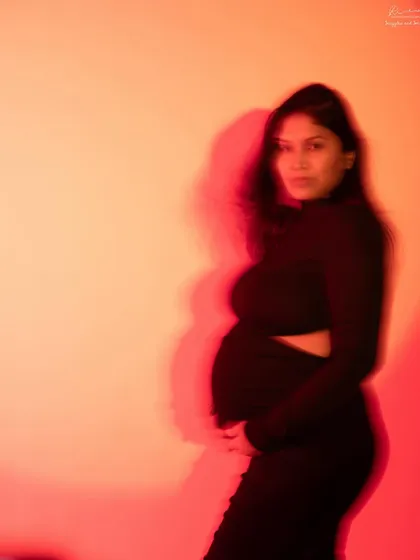 A slightly sharper version of the light-play portrait, where you can see the mother's expression within the colorful blur. It's a beautiful blend of art and emotion.