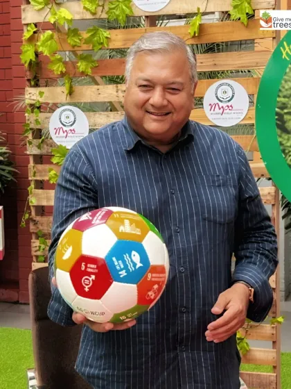 Holding a ball representing the UN Sustainable Development Goals. It's a great visual tool to explain to students how our environmental work connects to larger global goals.