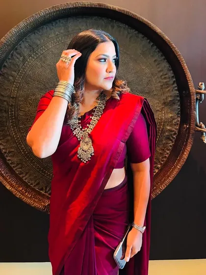 A close-up of my "desi vibes" look, showing the details of the jewelry and the rich color of the saree.