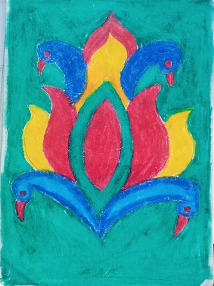 This is a freehand design by Rishita, a 4th standard student, using oil pastels. The symmetrical design with peacock motifs shows her control and creativity.
