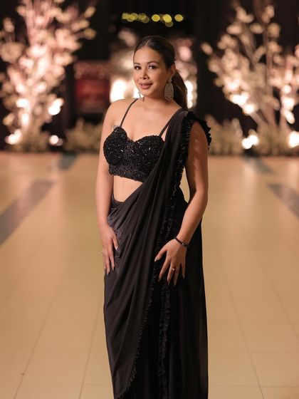 You can never go wrong with a classic black saree. This look is my go-to for an elegant and sophisticated evening, perfect for hosting a formal reception or cocktail event.