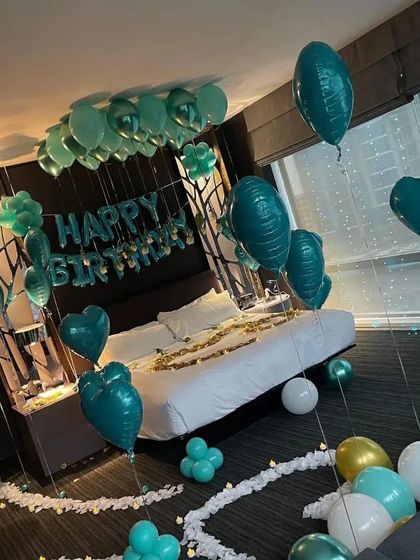 A wide shot of the teal-themed birthday room, showing how the decorations fill the space and create a cohesive look.