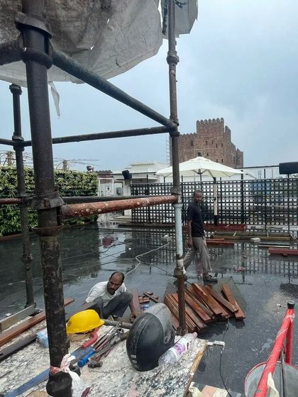 A work-in-progress shot from a large rooftop project. Our team works with professional equipment and scaffolding to ensure safety and precision during installation.