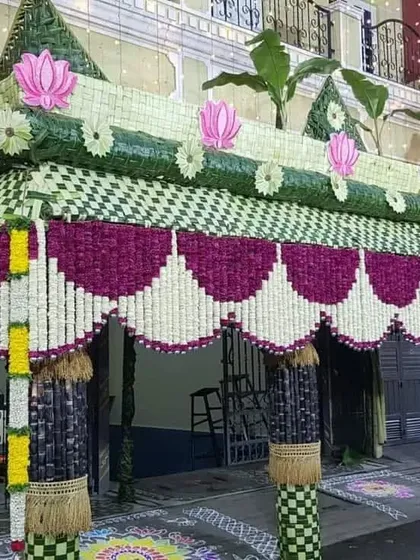 This grand 'chapra' showcases my expertise in traditional decor. Intricately woven with coconut leaves and adorned with flowers, it creates an impressive and authentic welcome for guests at a home-based ceremony.