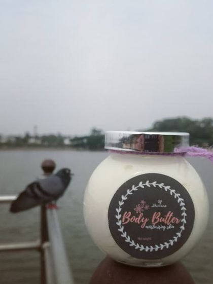 My handmade Body Butter, enjoying a moment by the lake. It’s made with shea butter and coconut oil to deeply moisturize and heal dry skin.