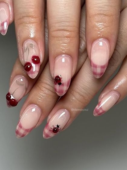 A sweet and trendy cherry design on a sheer base, combined with a pink plaid pattern on the tips.