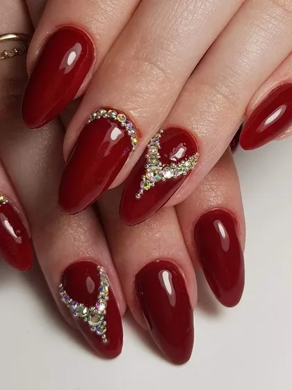 For the bride who wants to make a statement. This design features a deep red gel polish with intricate, hand-placed crystal work, creating a look that is both luxurious and unforgettable for your special day.