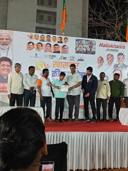 Another shot of the award ceremony, capturing the official presentation of the certificate. These formal recognitions are an important part of a competitive athlete's journey.