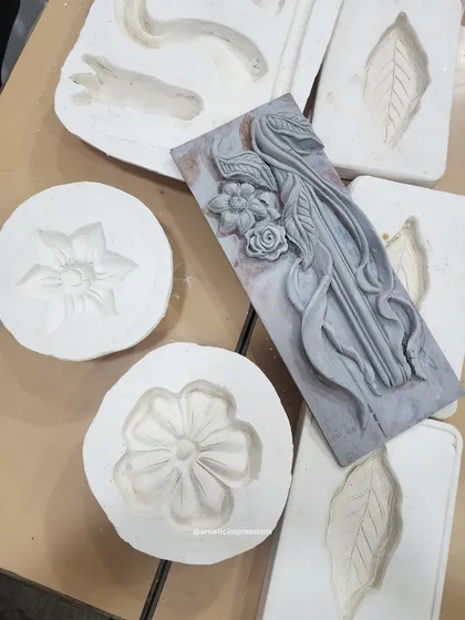 These are the molds used to create the floral elements for the South Mount mural. We first sculpt the original piece in clay, then create a mold to cast multiple, identical elements for a larger composition.