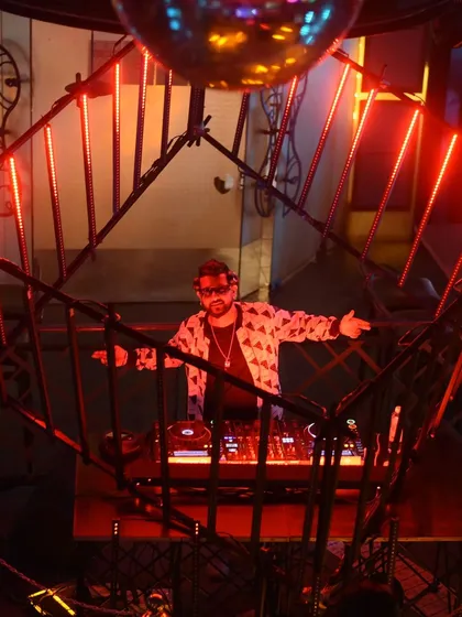 Interacting with the crowd from the DJ cage.