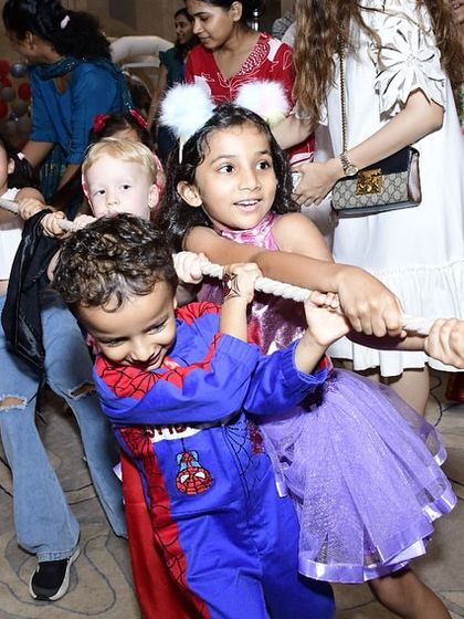 The classic tug-of-war game brings out smiles and teamwork. I organize a schedule of games to keep the party flowing and the energy up.