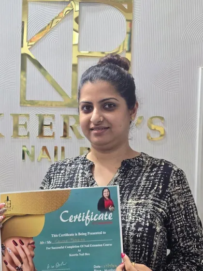 A proud moment awarding a certificate to a dedicated student. This paper represents hours of practice, learning, and the start of a new professional journey.