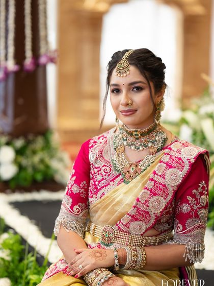 A close-up portrait showcasing the soft glam makeup and intricate jewellery chosen for a Muhurtham ceremony.