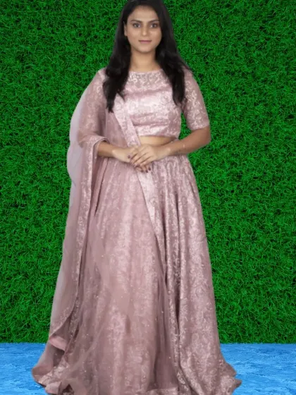 Beyond gowns, I offer stunning ethnic wear like this intricately designed pink lehenga set. It’s a beautiful option for pre-wedding festivities or a modern take on traditional photoshoots.