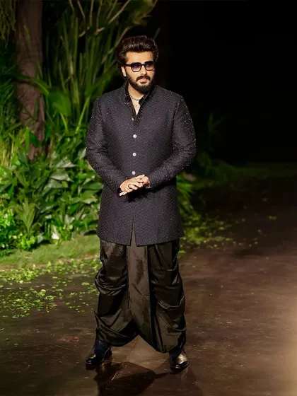 Arjun Kapoor on the runway for Kunal Rawal, set against the dense, forest-like environment I created. The dark, organic backdrop was designed to make the intricate details of the menswear collection stand out.