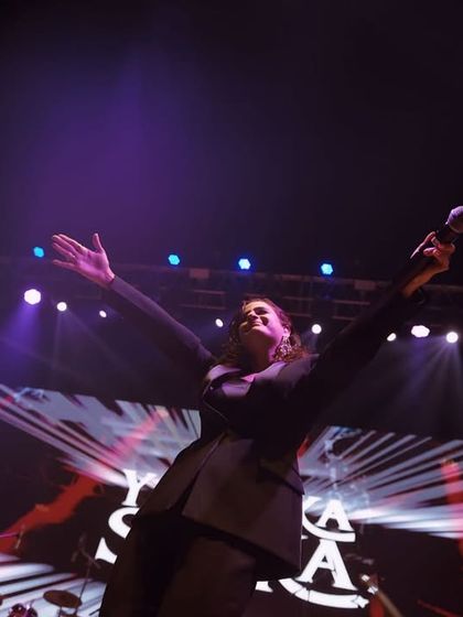 A performer on stage at the Ganga Kinare Music Festival. Even within corporate events, I focus on capturing the entertainment with artistic flair.