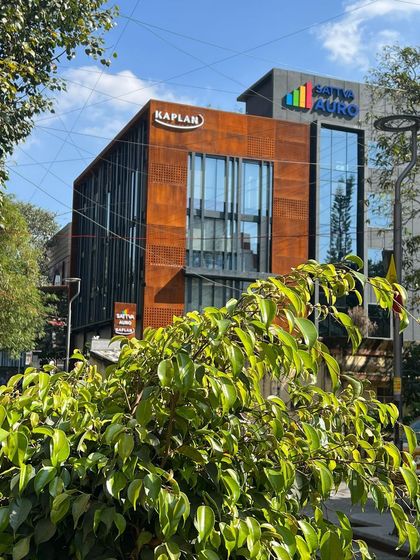 This street-level view of Sattva Auro shows how the building integrates into the urban environment of Church Street, Bangalore.