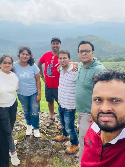 A selfie of our group on a beautiful green meadow in Chikmagalur.
