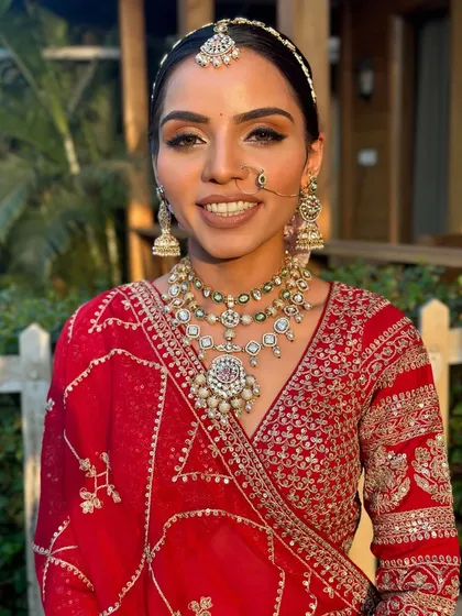 A beautiful smile from the bride. This shot shows how the makeup looks natural and radiant, allowing her personality and happiness to be the main focus.