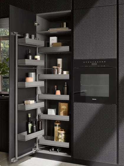 This tall pantry unit features individually adjustable shelves, allowing you to customize the storage to fit everything from tall bottles to small spice jars.