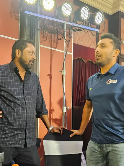 A candid conversation during the event. Sharing ideas and passion for cricket with fellow enthusiasts.