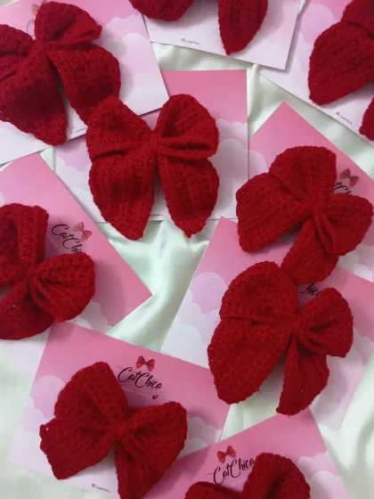 A whole batch of our red crochet Sailor Bows, ready for a large order. They are a popular choice for group outfits or party favors.