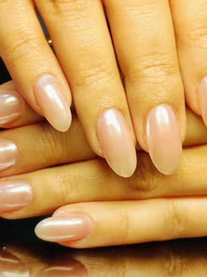 Another view of the classic sheer pink manicure, perfect for an everyday elegant look.