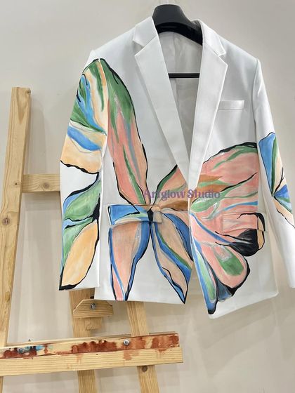 Another view of the pastel floral blazer, displayed on an easel like the piece of art it is. The oversized design makes a powerful fashion statement.