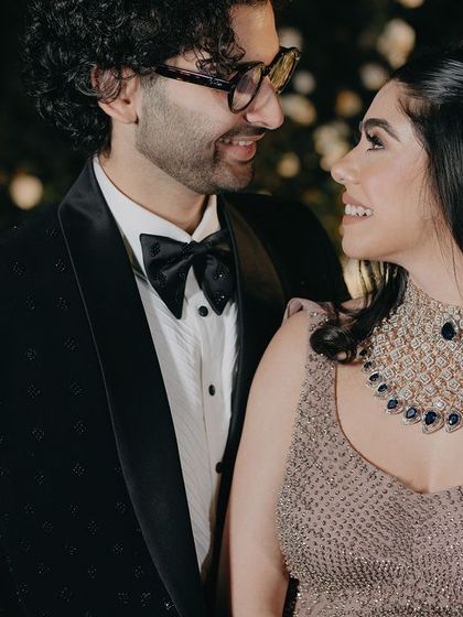 A close-up capturing a moment of genuine connection. The way they look at each other, with soft smiles and sparkling eyes, speaks volumes about their love story.