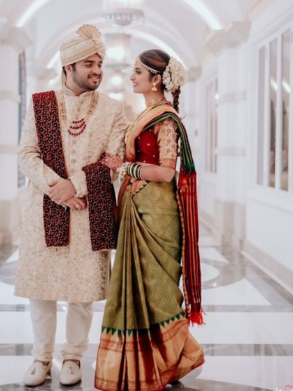 An afternoon reception look for this adorable couple. The bride is wearing a beautiful silk saree with a traditional braid and elegant makeup.