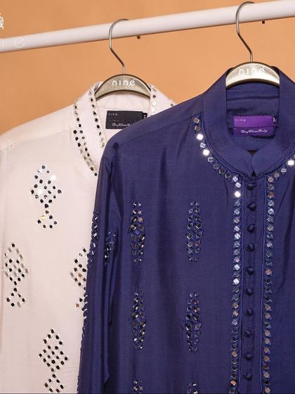 A side-by-side view of our mirror work kurtas in white and blue. Whether you prefer a classic or a colorful look, the intricate craftsmanship remains the same.