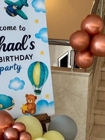 The welcome sign for the transportation-themed first birthday, coordinating perfectly with the main decor.