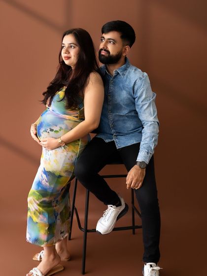A stylish couple's portrait where they are looking off-camera together, creating a sense of shared dreams and anticipation.